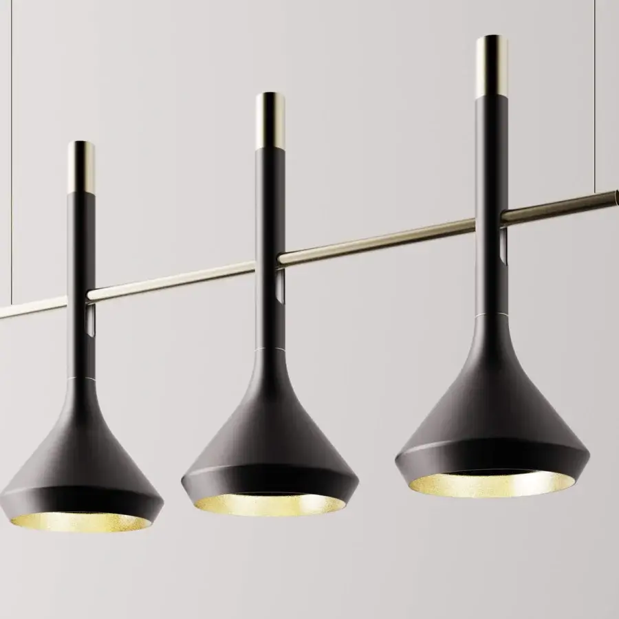 Distinguished Turri Tubular Bells suspension lamp with matte black lampshades and gold interiors crafted in recyclable metal
