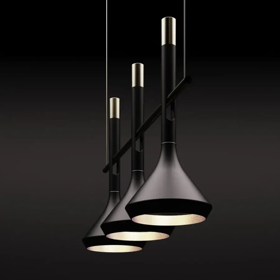 Distinguished Turri Tubular Bells suspension lamp with matte black metal shades and polished gold-toned accents