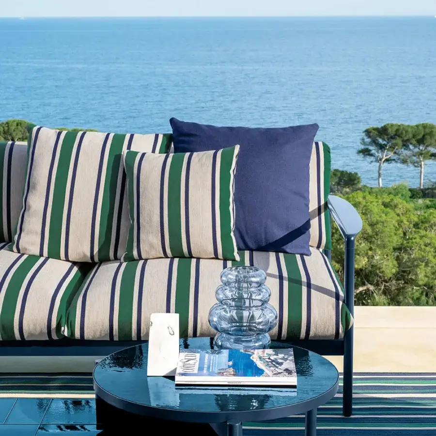 Distinguished Talenti Nalu sofa with transforming seat cushions, vibrant striped textile and glossy blue semi-polished aluminum frame