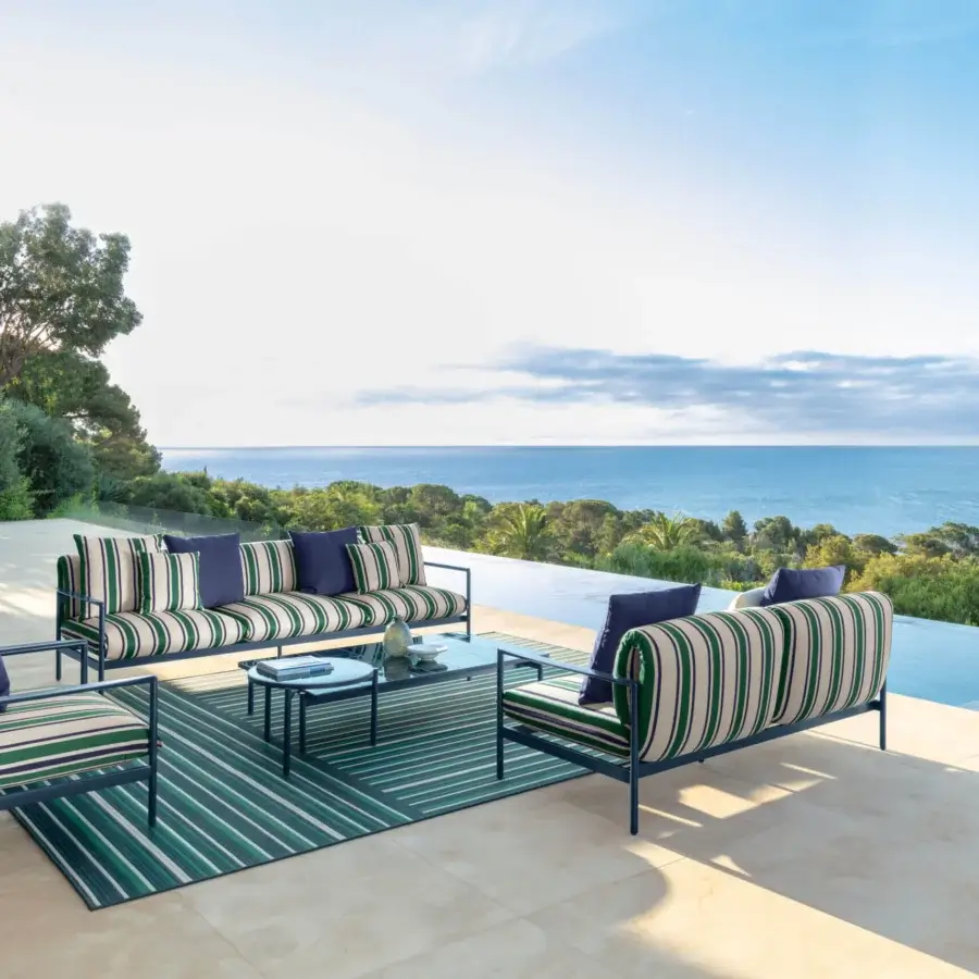 Elegant Talenti Nalu sofa with sinuous aluminum frame and cream green striped textile cushions offering comfortable seating