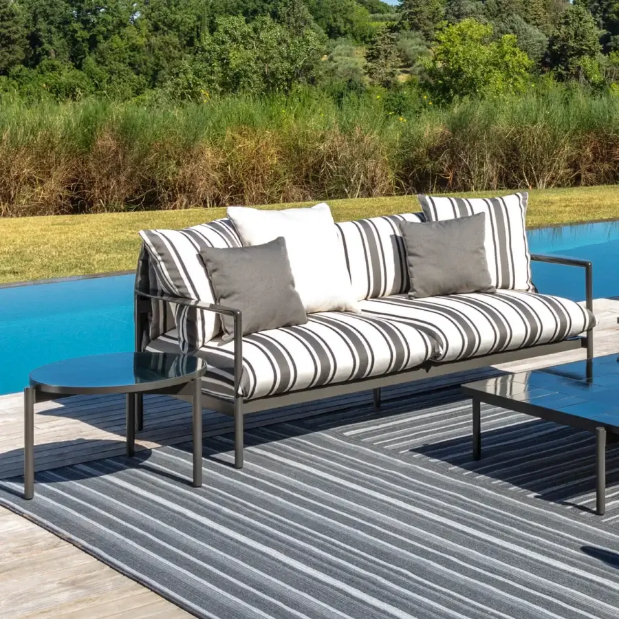 Distinguished Talenti Nalu sofa with black and white striped cushions and semi-polished aluminum frame