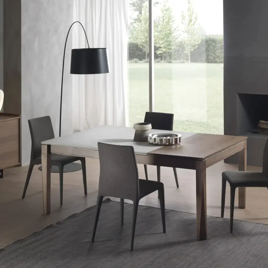 Exceptional Pacini & Cappellini Plurimo table crafted with ash wood and Cimento in a light gray-white matte finish with a patented opening mechanism