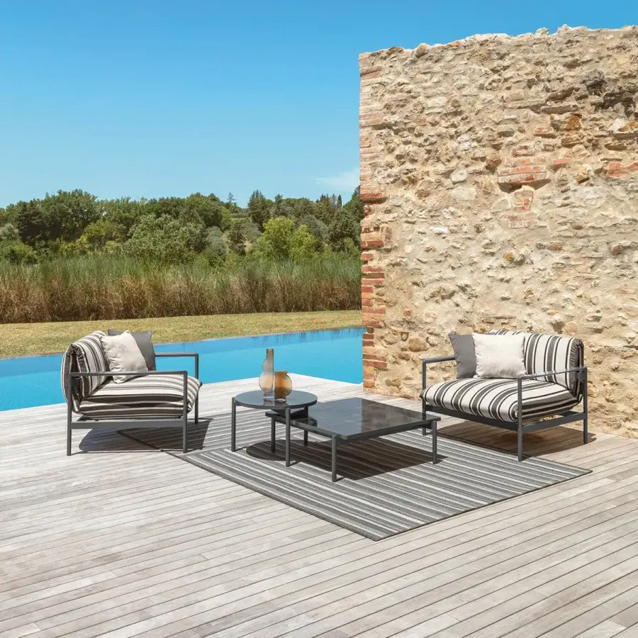Sophisticated Talenti Nalu lounge chair with painted aluminum frame and striped black, gray, white fabric upholstery