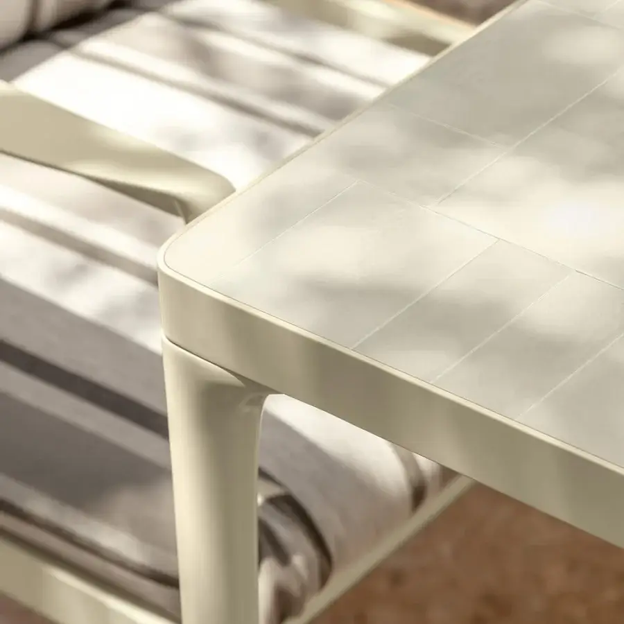 Distinguished Talenti Nalu armchair with gray and white striped cushions and semi-polished light beige aluminum frame with attached table