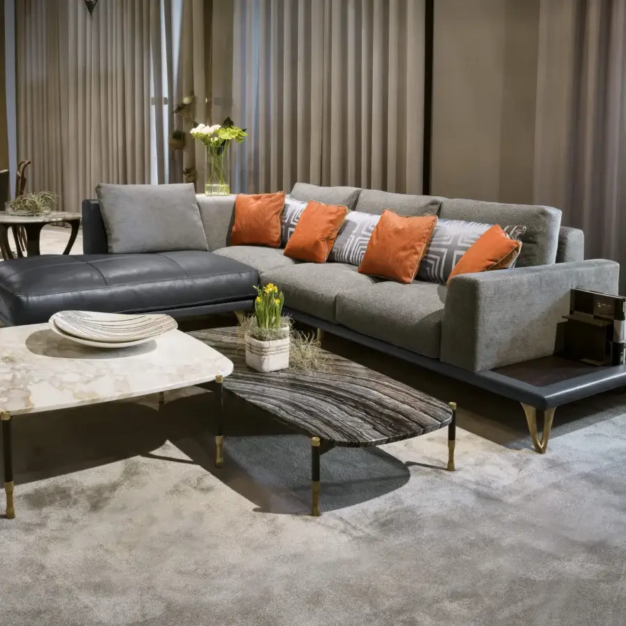 Captivating BelMondo by Bellotti Ezio Patagonia coffee table with striated stone and dark legs accented with gold details, smooth finish