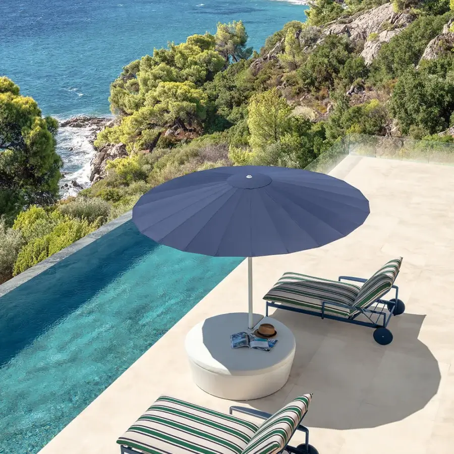Distinguished Talenti Nalu lounger with dark gray metal and comfortable textile seating in dark teal and cream stripes