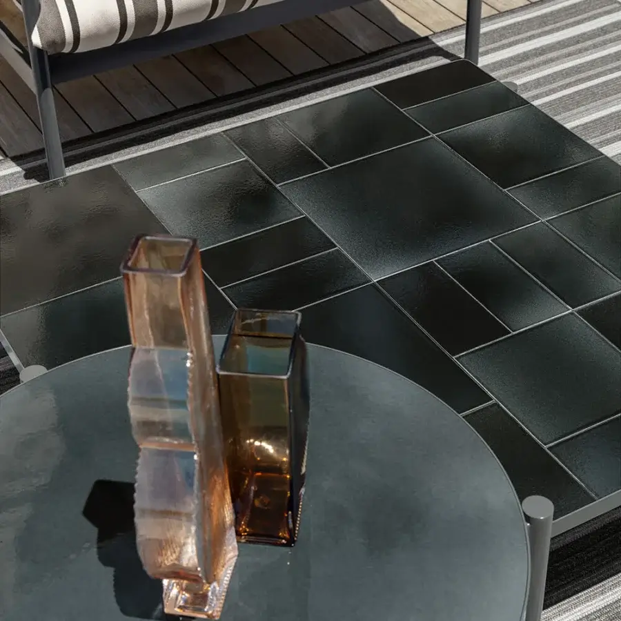 Distinguished Talenti Nalu coffee table with sleek circular form crafted in dark gray glazed stoneware and aluminum with glossy finish