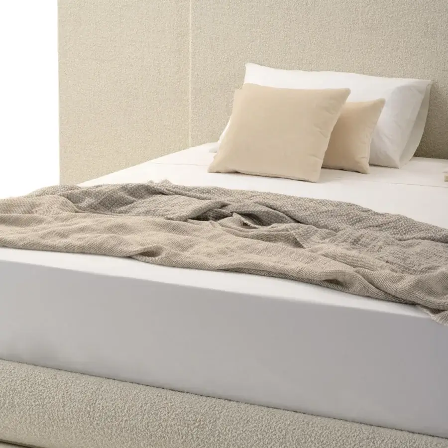 Distinctive Turri Roma bed with textured fabric or leather and softly rounded wings for a welcoming contemporary aesthetic