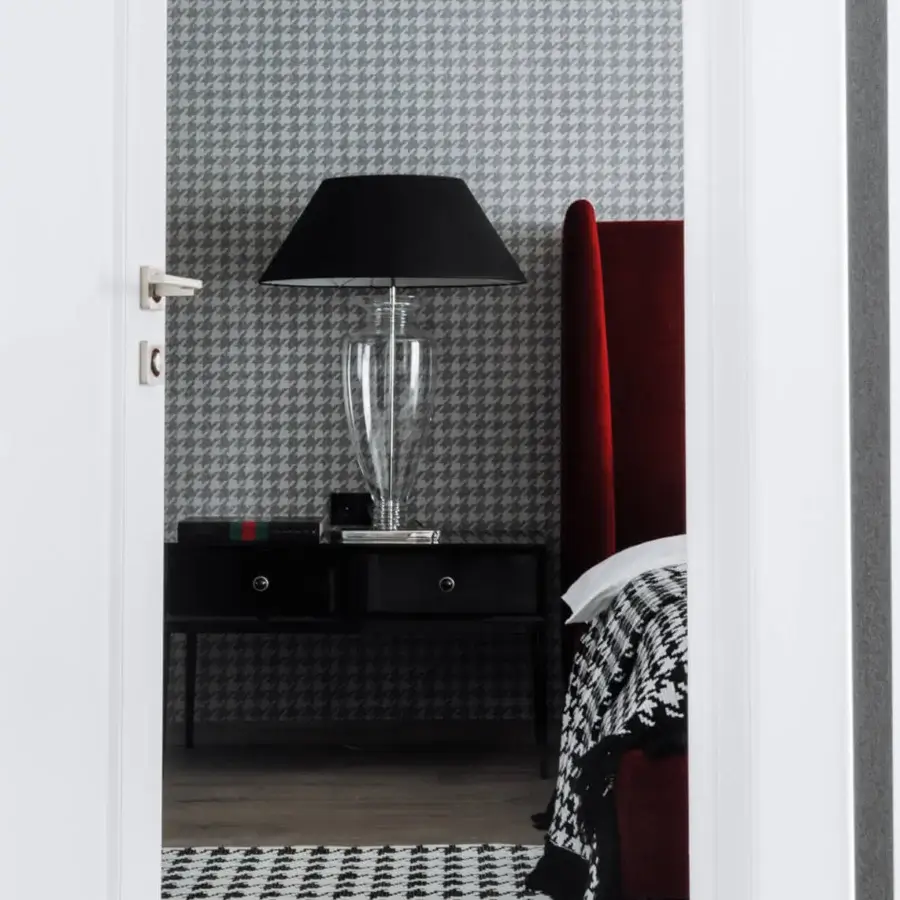 Distinguished Italamp Ambrosia table lamp crafted in blown glass with a nickel finish metal base and black fabric shade