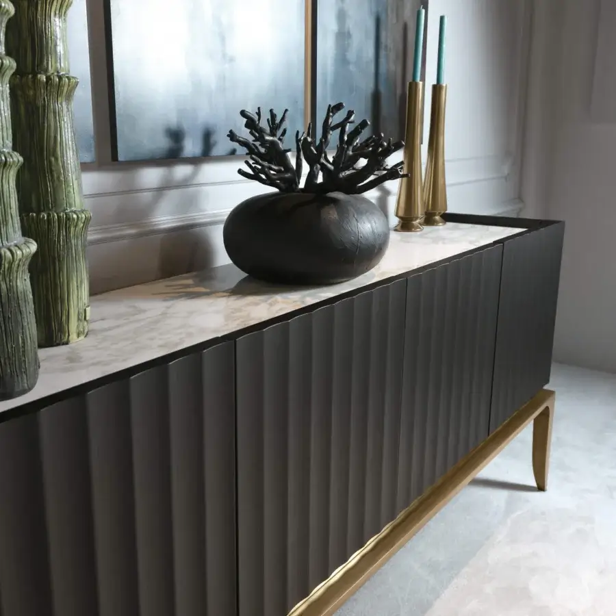 Lavish BelMondo by Bellotti Ezio Auriga sideboard crafted in dark gray grooved wood with a curved gold base and polished marble top