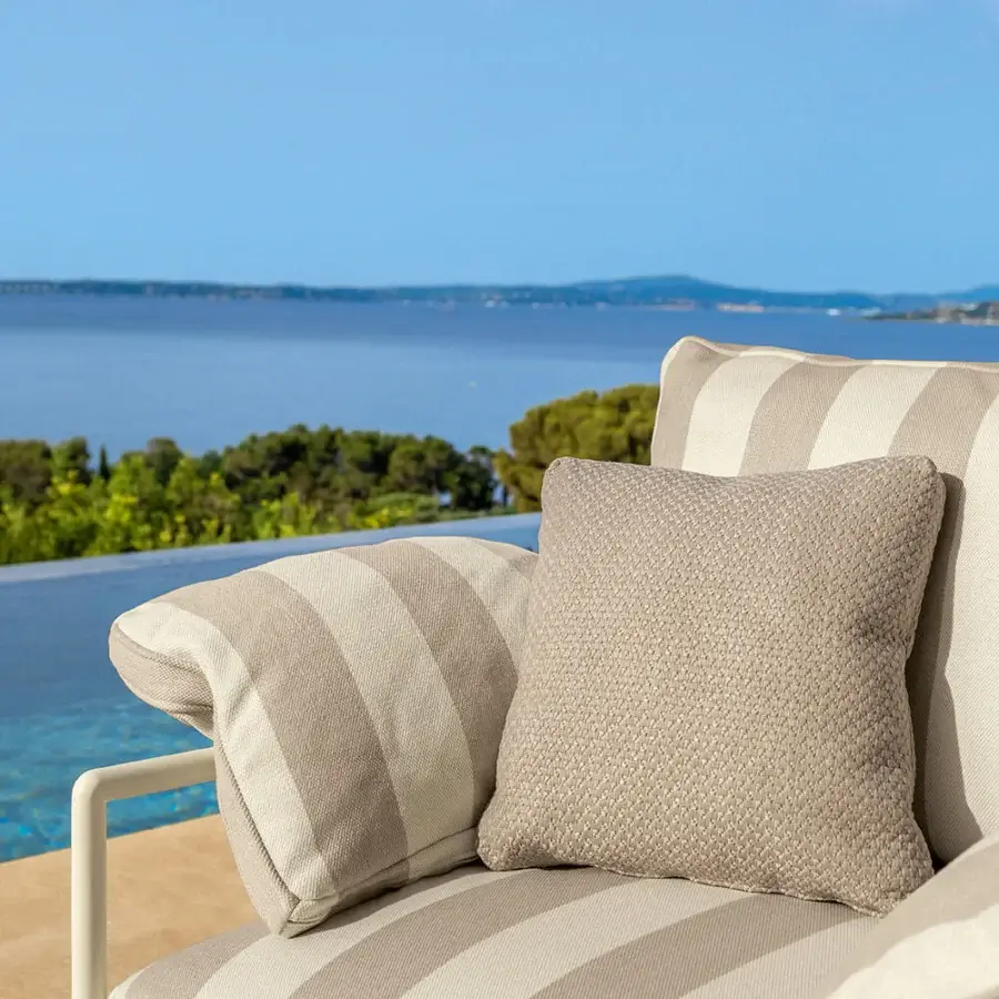 Sophisticated Talenti Capri lounge chair with striped beige textile upholstery and powder-coated metal frame