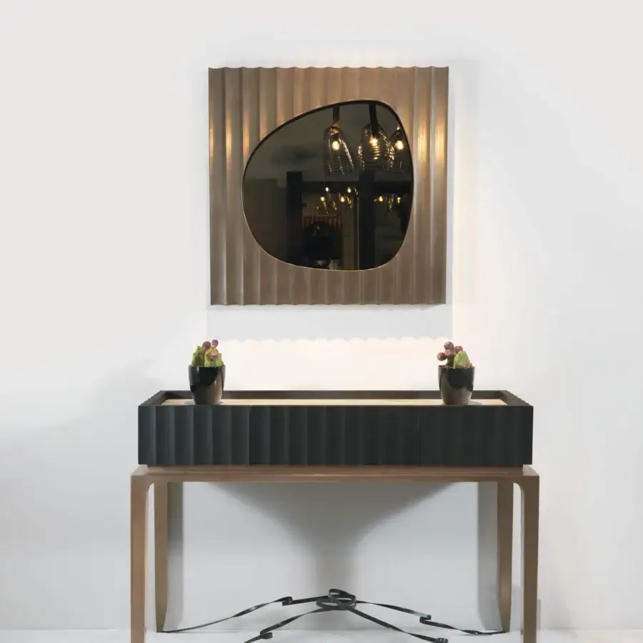 Exceptional BelMondo by Bellotti Ezio Auriga mirror with asymmetrical oval reflective surface and textured muted gold metal frame