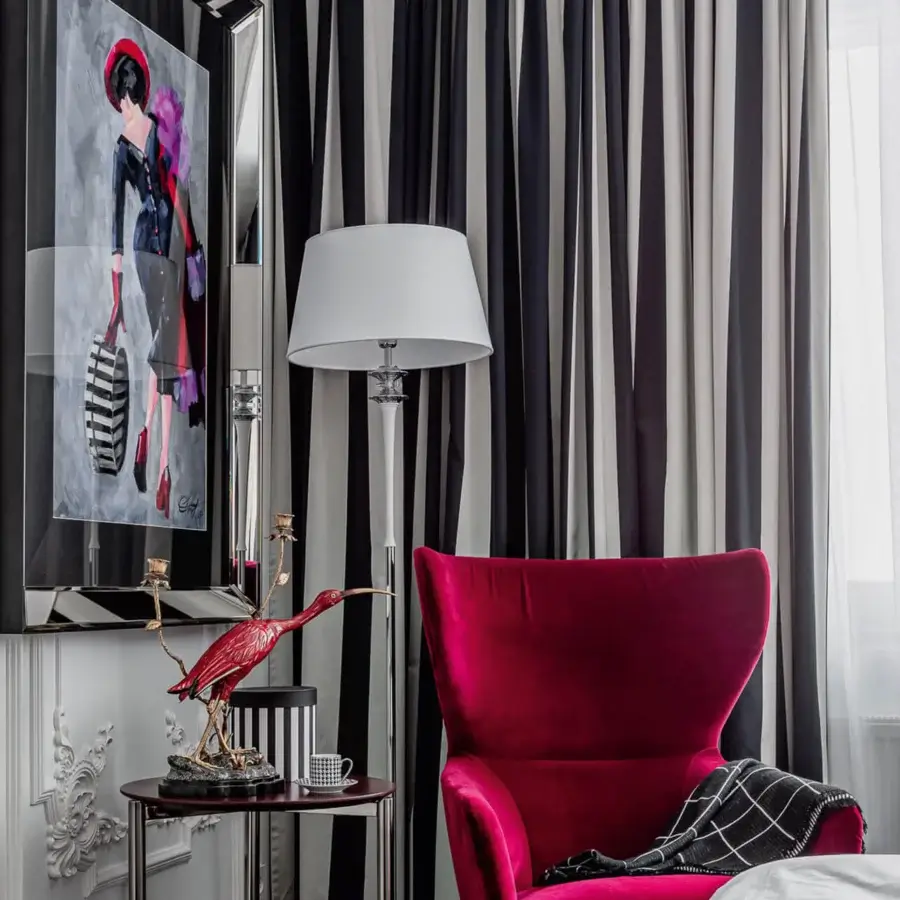 Elegant Italamp Agata floor lamp with slender metal structure and refined transparent glass detail in polished chrome and white finish