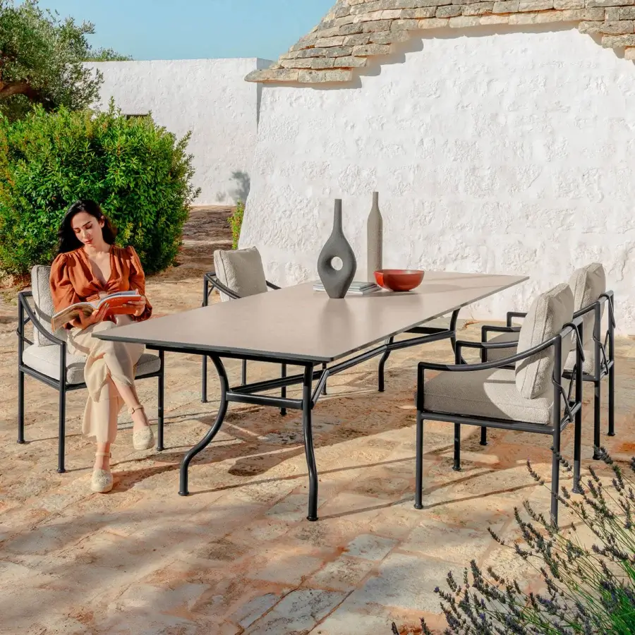 Superior Talenti Capri table with curved legs and neutral beige ceramic top in smooth matte finish