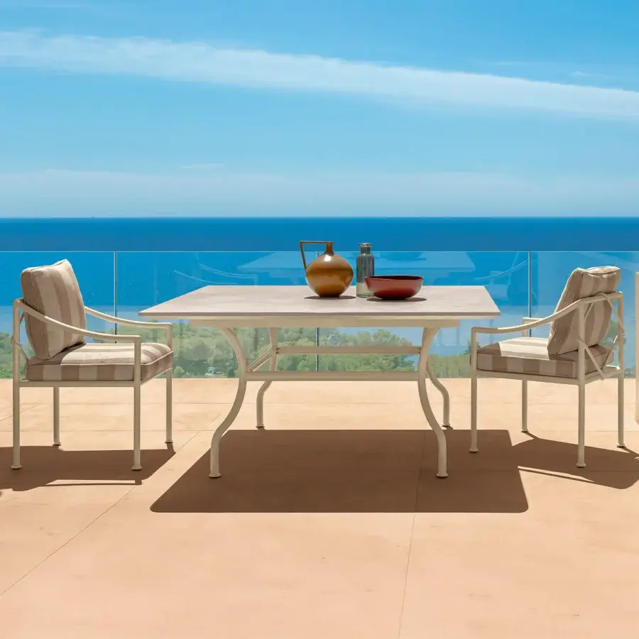 Superior Talenti Capri table with light ceramic top and robust metal frame in a subtle, light beige coloration