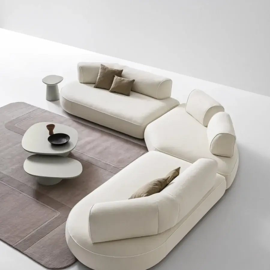 Superior Ditre Italia Isla Slim sectional with inviting rounded shapes upholstered in soft off-white textile with matte finish