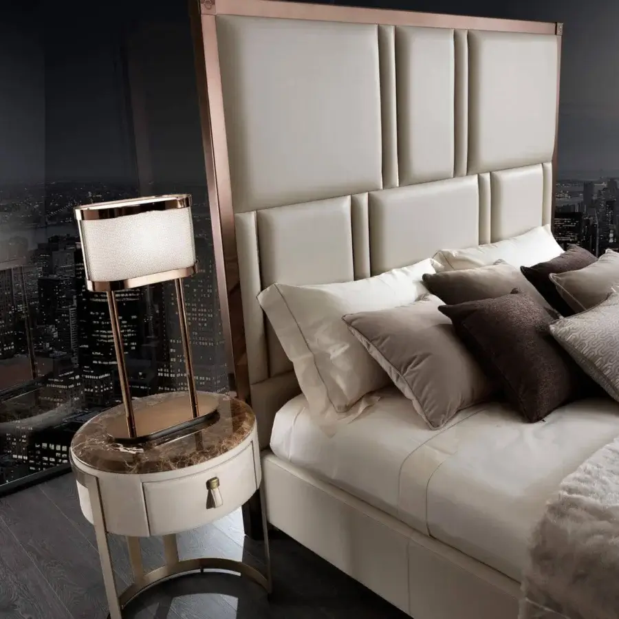 Exclusive DV Home Collection Elite bed with a neutral upholstery and gold steel frame insert creating a stylish aesthetic