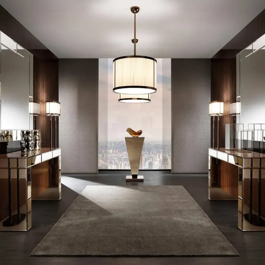 Distinguished DV Home Collection Envy console built with a natural mirror finish and shining stainless steel base