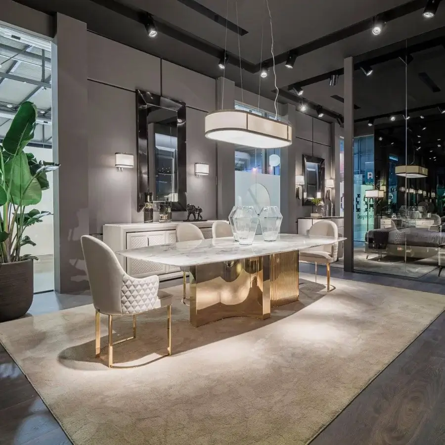 Distinguished DV Home Collection Tiffany mirror with shining stainless steel frame and natural glass reflecting a textured rug