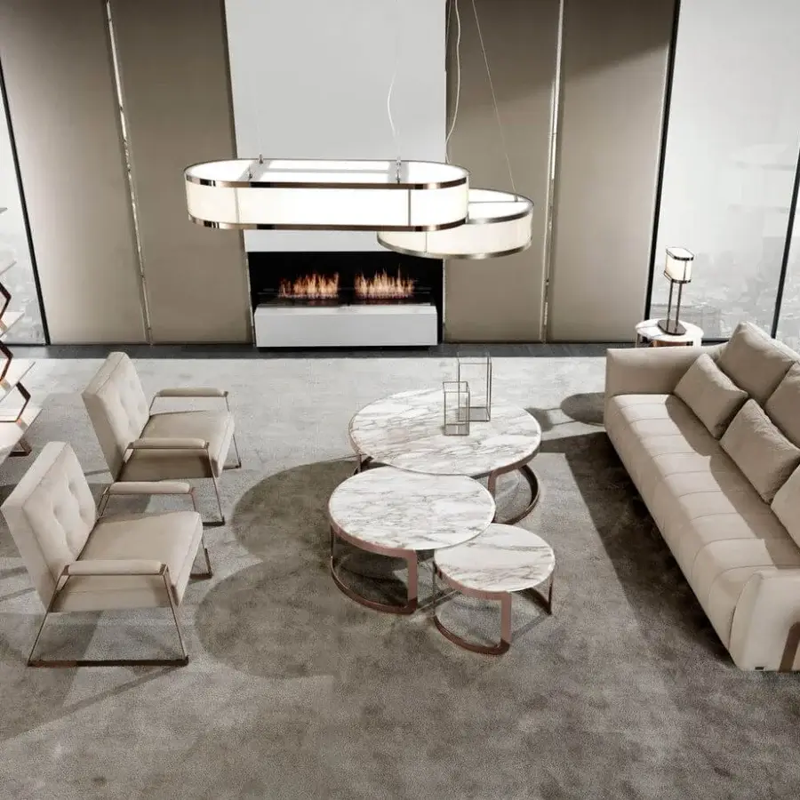 Elegant DV Home Collection Coco coffee table with light beige textile and marble top built with a steel base