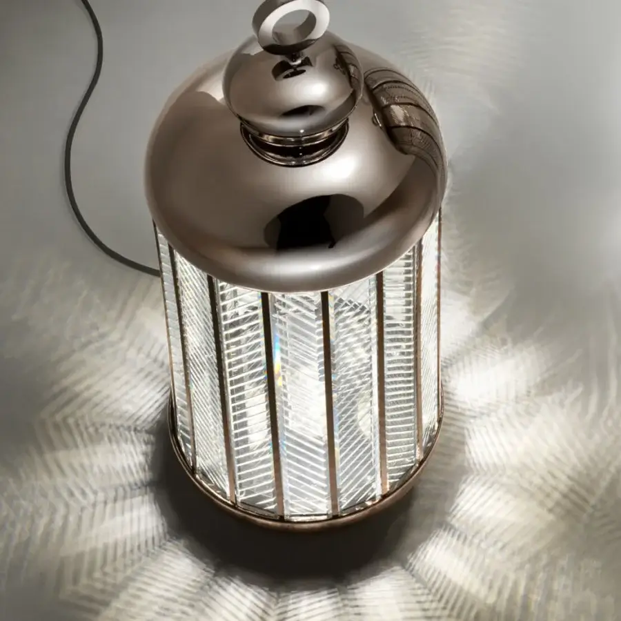 Exceptional Italamp Fata Morgana lamp with hand-carved glass set in an iron grey metal frame creating patterned light
