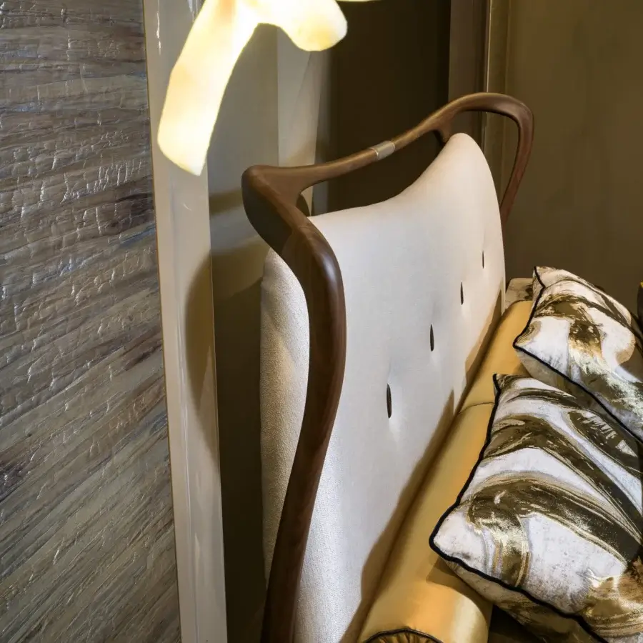 Lavish BelMondo by Bellotti Ezio Crono bed with sinuous silhouette, light textile headboard, and dark walnut finished wooden frame