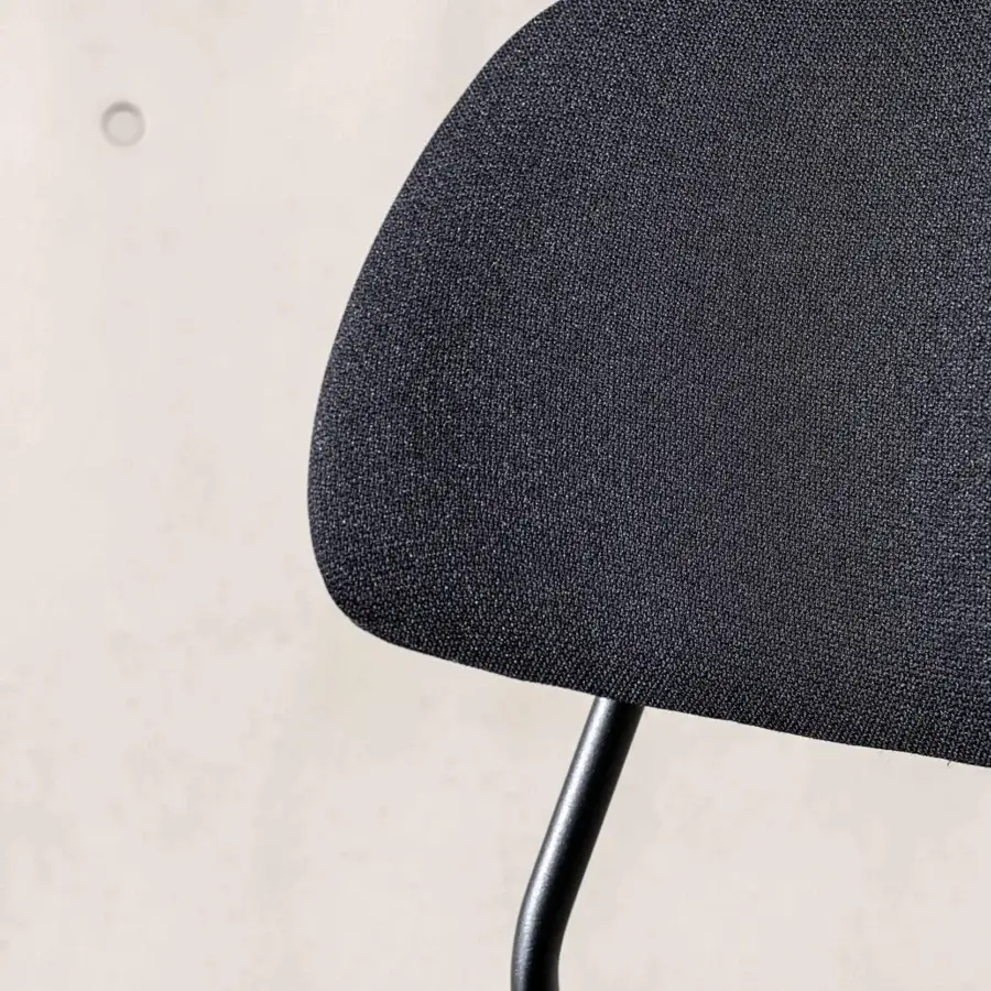 Distinguished Sovet Italia Soft chair with curved multi-layered wood and dark textured textile upholstery, built with a lacquered metal structure