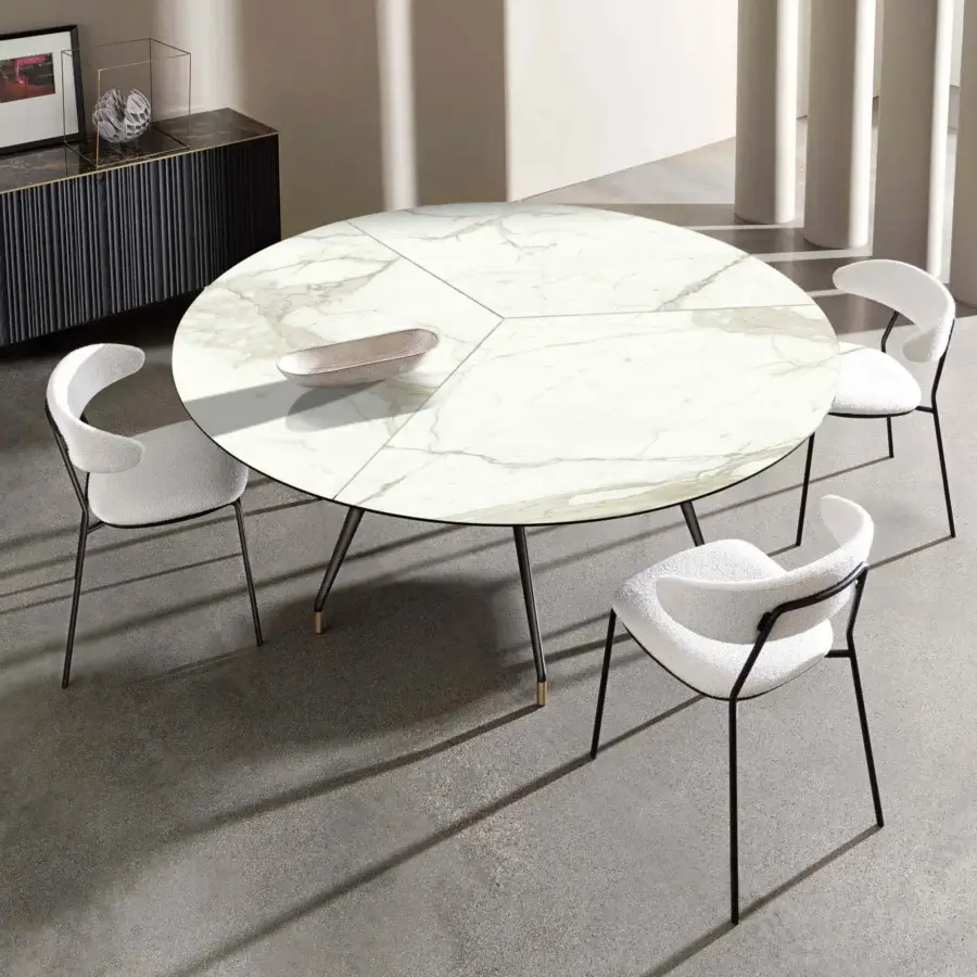 Distinguished Sovet Italia Arkos XXL table with light faux marble top and dark metal legs featuring gold accents