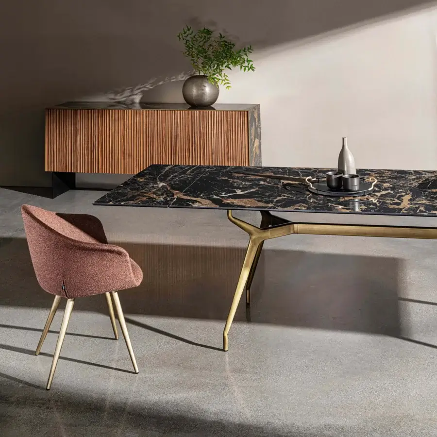Lavish Sovet Italia Arkos table with black marble-like tempered glass and brassy gold lacquered aluminum legs