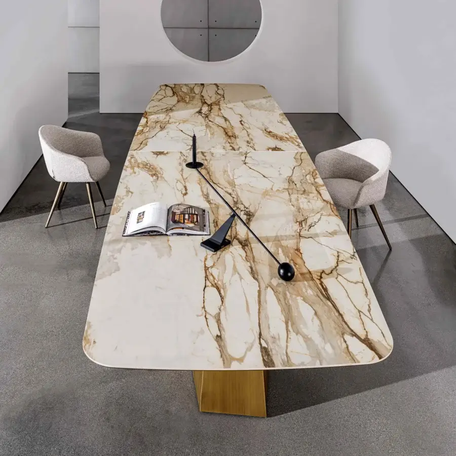 Distinguished Sovet Italia GranDeod MAXI table with a two-piece tabletop exhibiting light cream and brown veining in a lacquered golden metal base