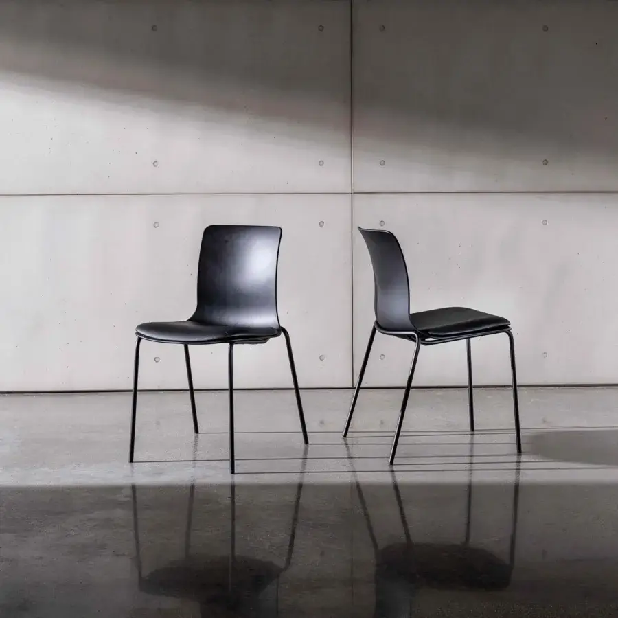 Elegant Sovet Italia Olly chair with sleek black synthetic material and slender metal legs in matte finish