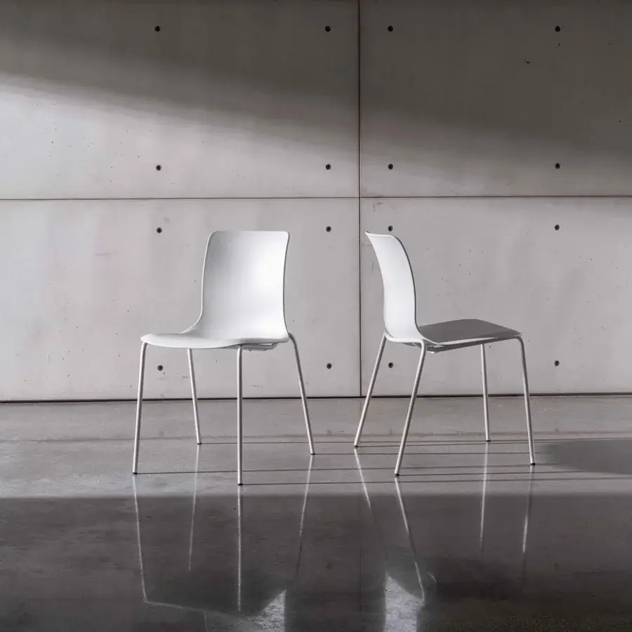 Superior Sovet Italia Olly chair with smooth matte white synthetic material and slim metal legs