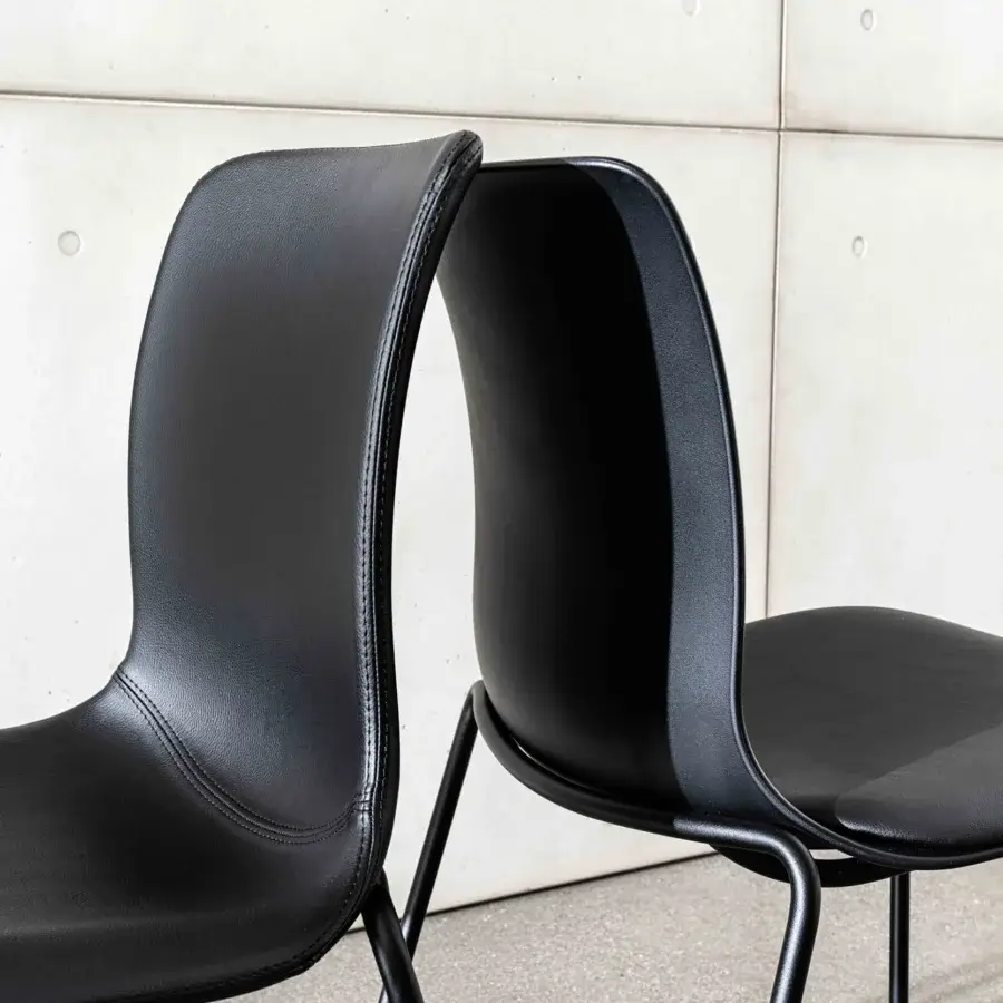 Superior Sovet Italia Olly chair in sleek black synthetic material with a matte finish and minimalist metal frame