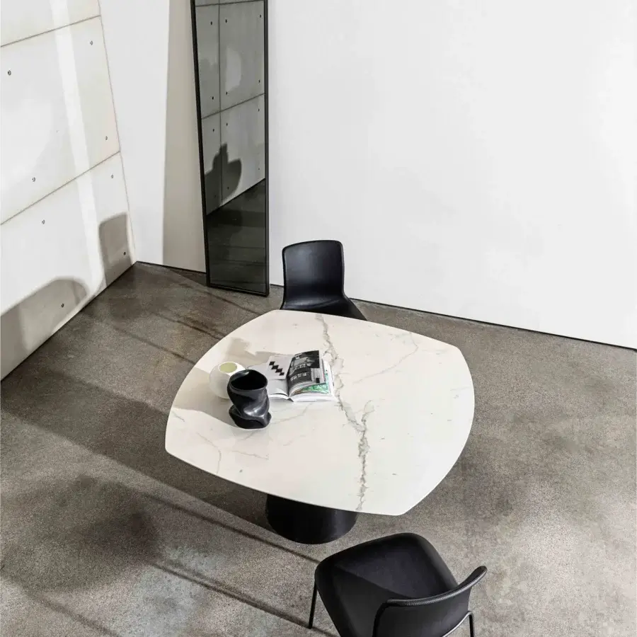 Exclusive Sovet Italia Olly chair with curved black synthetic seat and matte black metal legs available in even packs