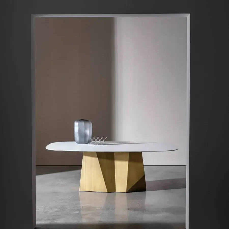 Exceptional Sovet Italia GranDeod table with elongated ceramic laminated tabletop and lacquered golden geometric base