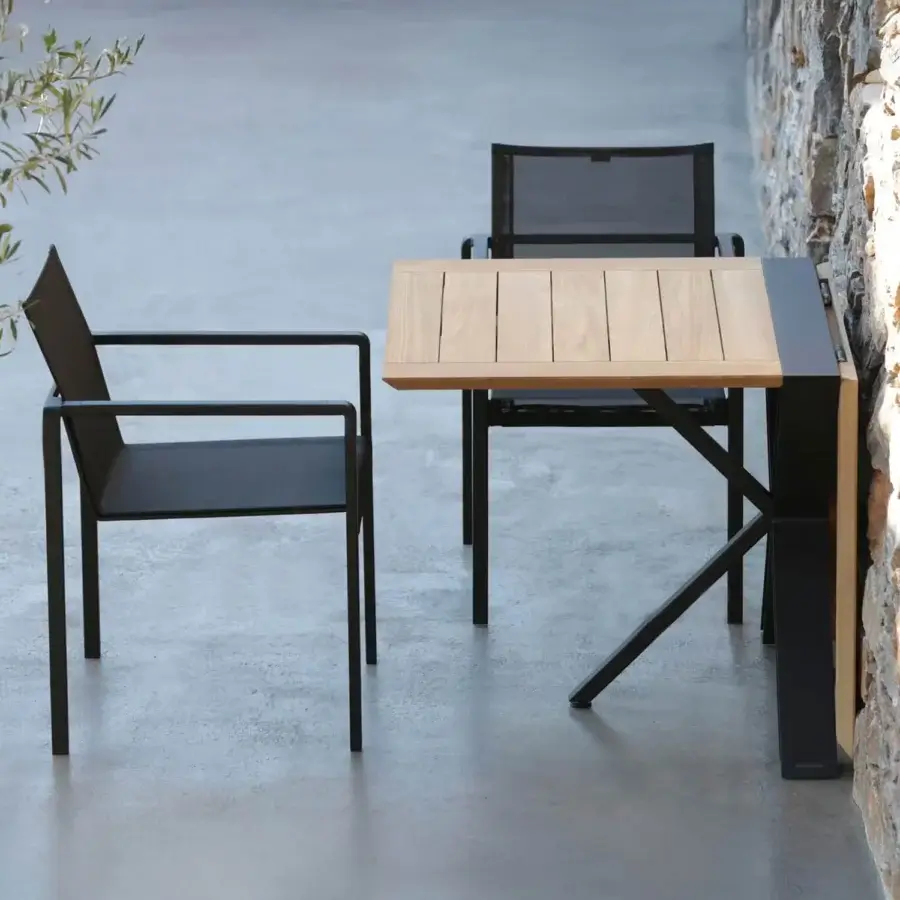 Alluring Royal Botania Alura armchair with geometric silhouette in black textured aluminum and dark seat construction