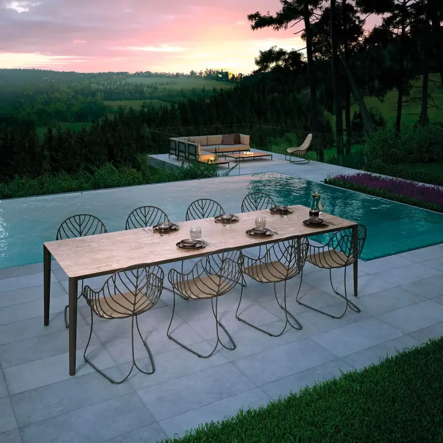 Sophisticated Royal Botania Folia armchair with a matte metal frame and light textile seat embodies contemporary design