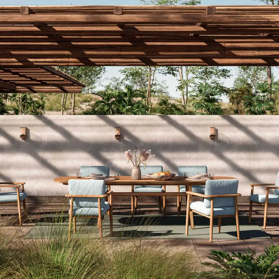 Sophisticated Royal Botania Zidiz armchair with light blue textile and teak wood frame exhibiting balanced lines