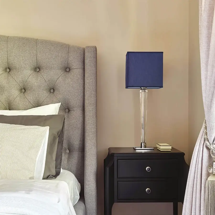 Distinguished Italamp Spillo table lamp with hand-carved transparent crystal base and dark blue fabric lampshade