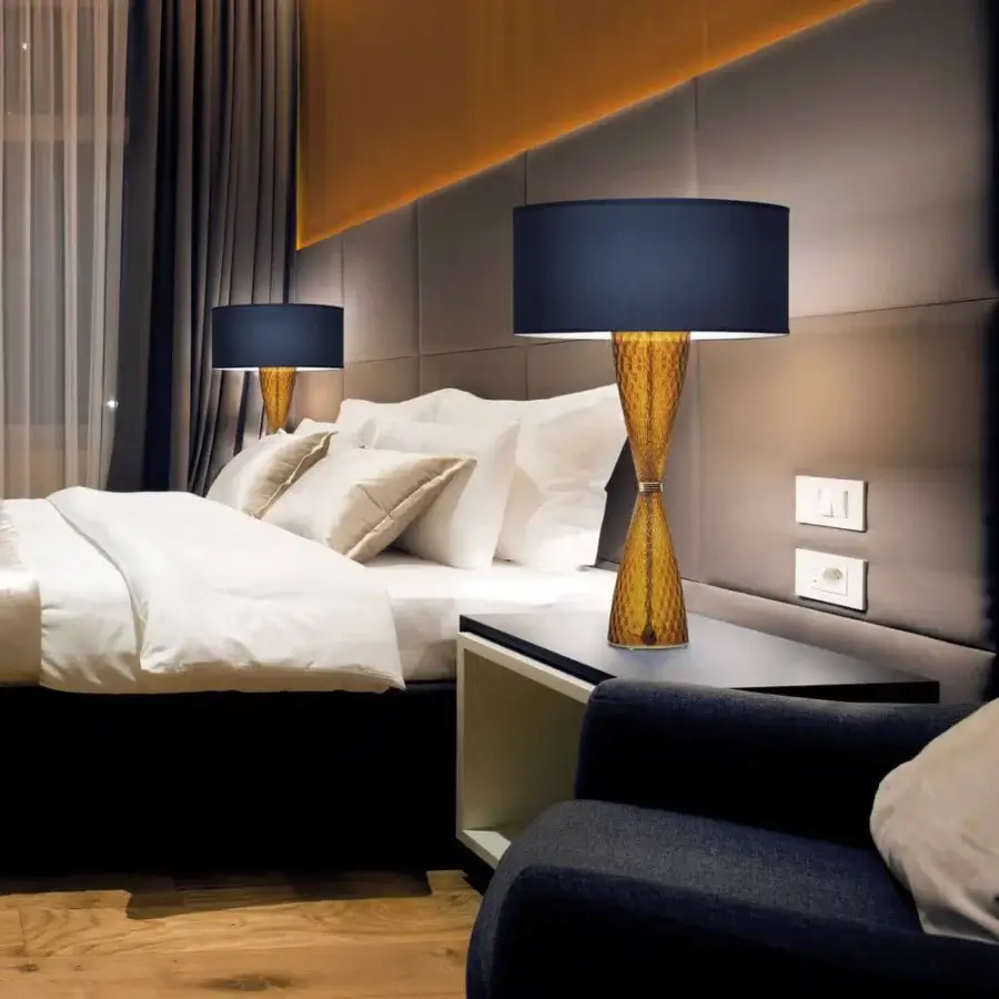 Elegant Italamp Cheers table lamp with amber textured glass body and dark blue fabric lampshade in chrome metal