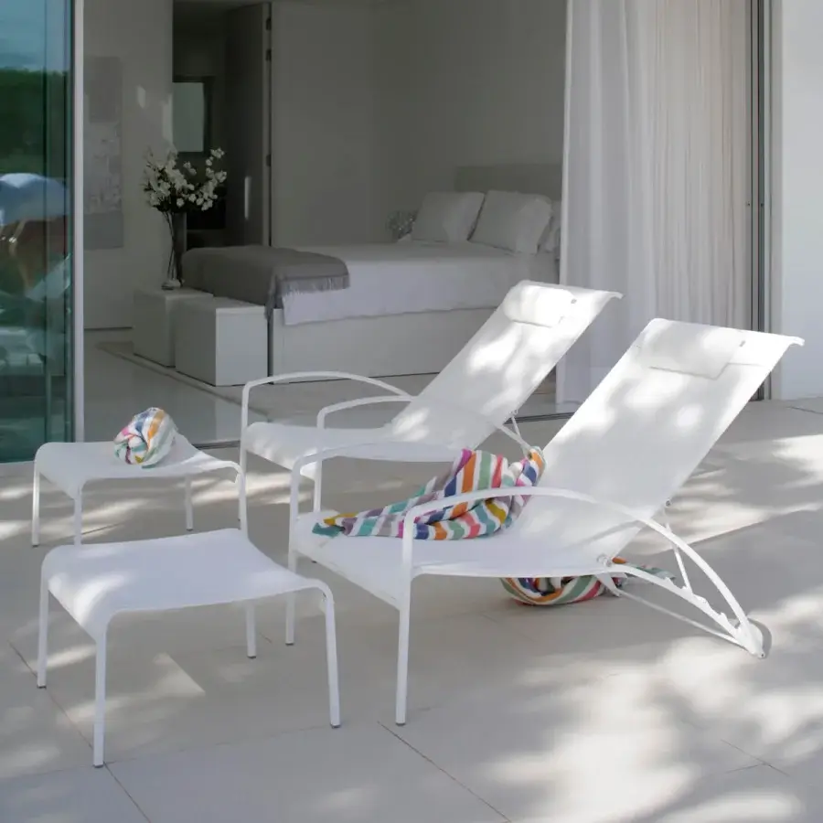 Sophisticated Royal Botania QT Lounger chair with crisp white Batyline seat and electro polished stainless steel frame