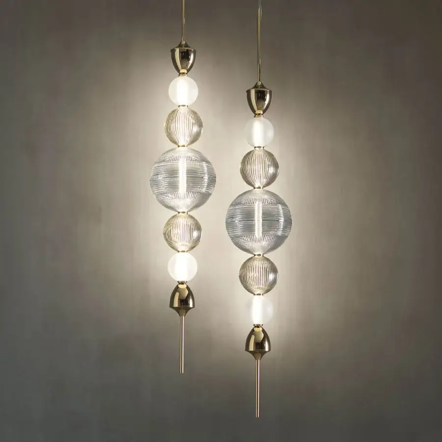 Distinguished Italamp Greta suspension lamp with hand-cut blown crystal diffusers and sleek light gold metal structure