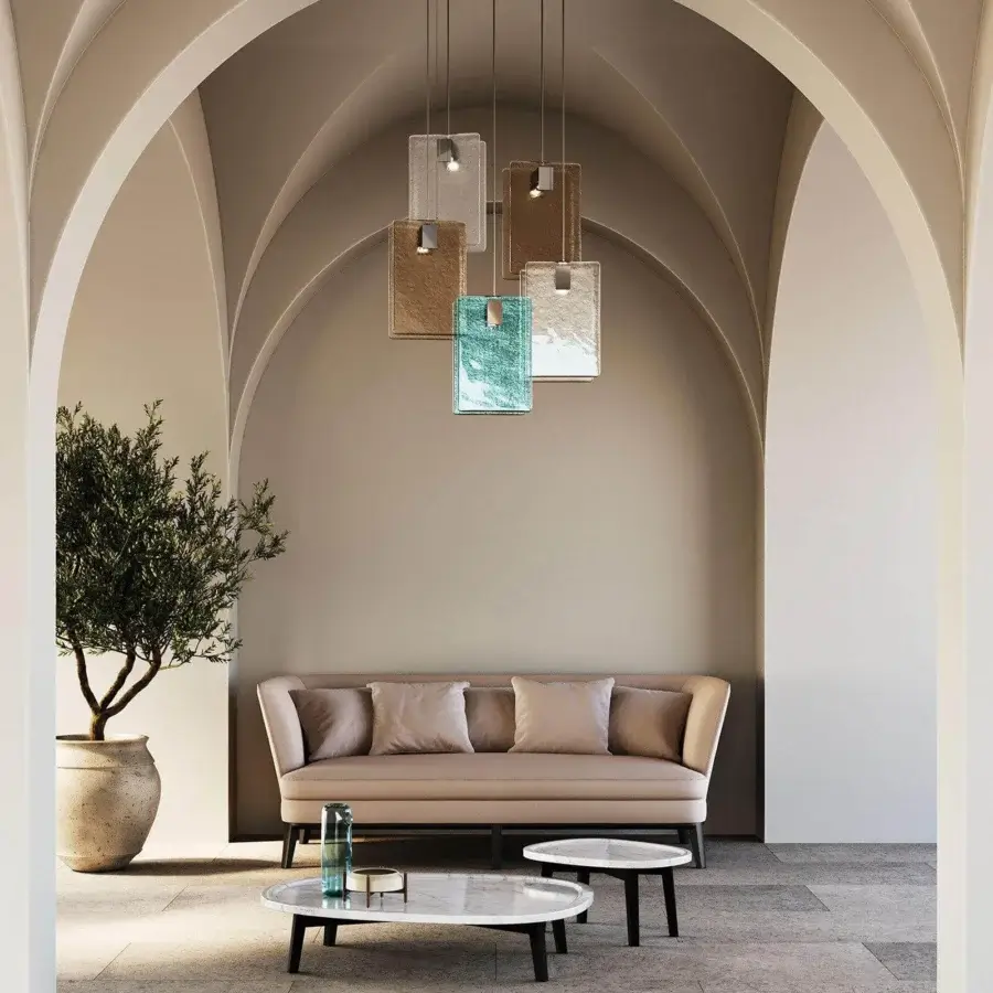 Distinguished Italamp Mura suspension lamp crafted with cast glass in light blue, clear, and brown with chrome metal details