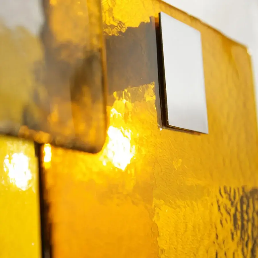 Superior Italamp Mura suspension lamp with cast glass body and metal chrome details showcasing a hammered texture