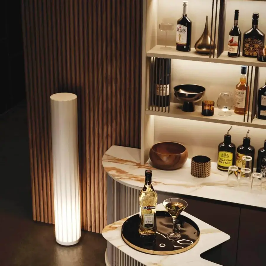 Distinguished Vismara Dry Bar counter with creamy beige lacquered structure and glossy “Calacatta Vecchia Macchia” stoneware top