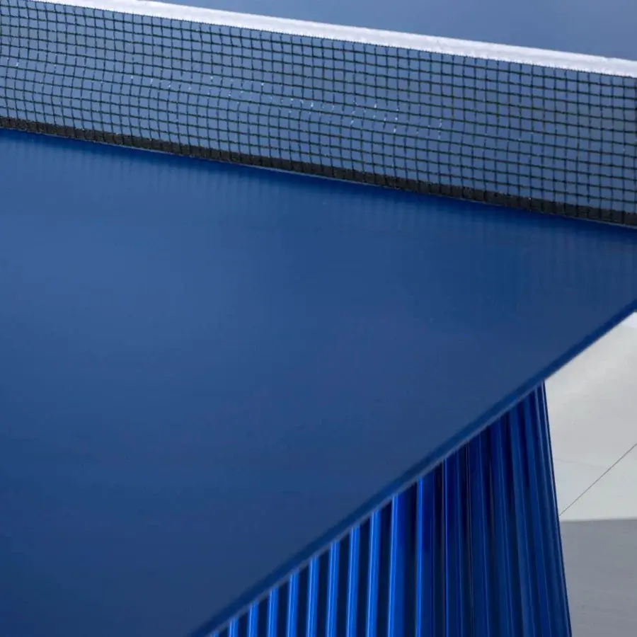 Elegant Vismara Egeo table-tennis table with saturated blue ceramic stone effect tabletop and concrete effect lacquer legs