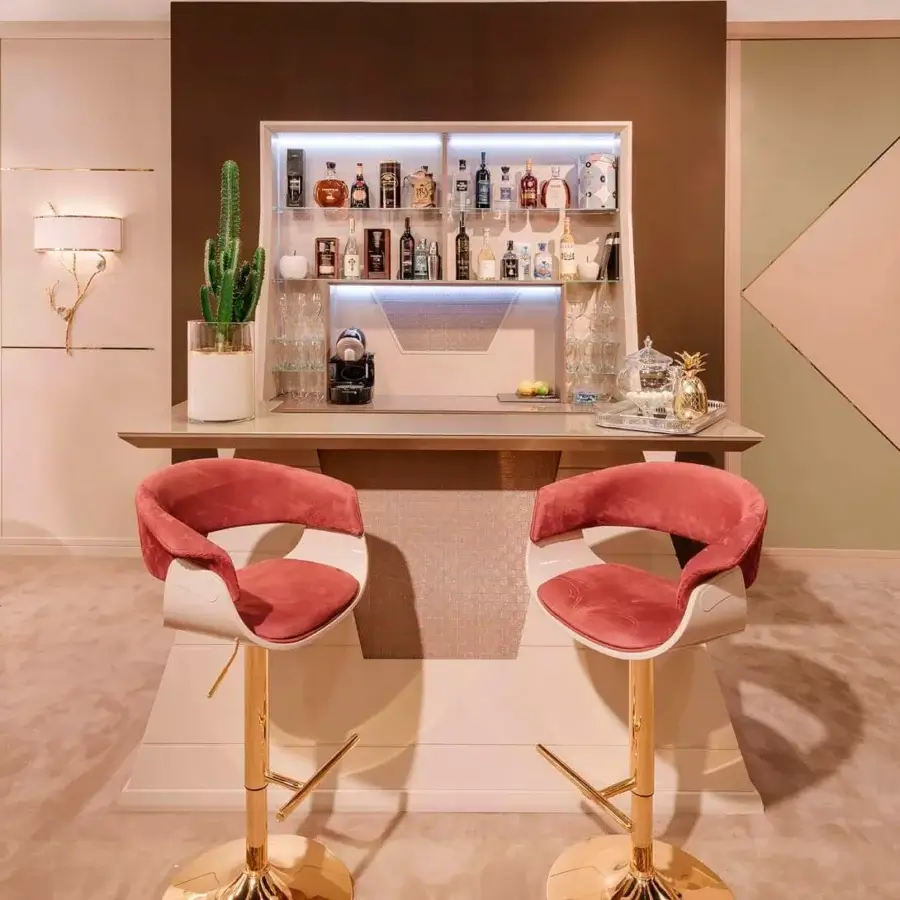 Distinguished Vismara Joyce stool with graceful curves and plush dusty rose velvet upholstery with gold-plated steel base and glossy lacquered wood