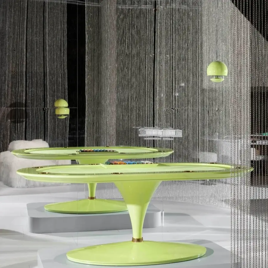 Distinguished Vismara Asso poker table with sleek oval silhouette crafted in light green printed microfiber and soft touch lacquered edge