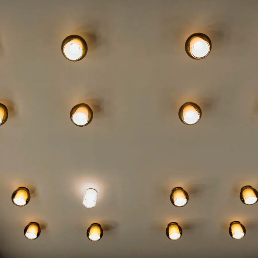 Elegant Penta Glo ceiling lamp crafted in metal with a smooth satin finish and pale gold tone