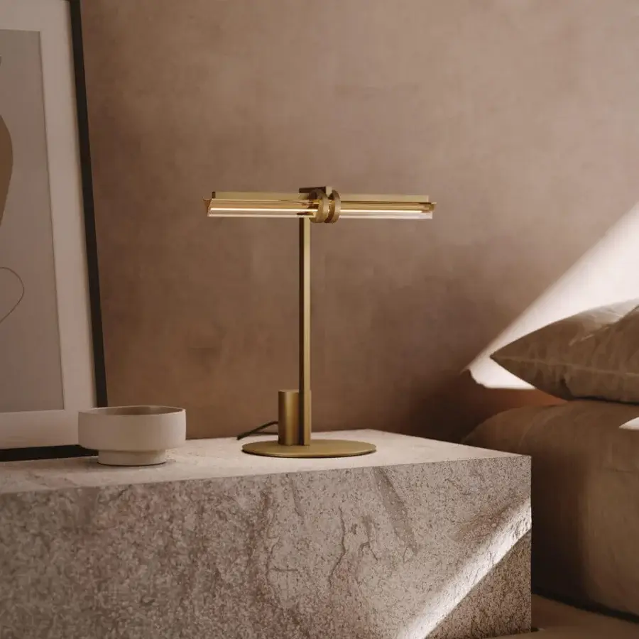 Elegant VENICEM Optical table lamp with a refined natural burnished brass structure and smoke grey crystal trihedron diffuser